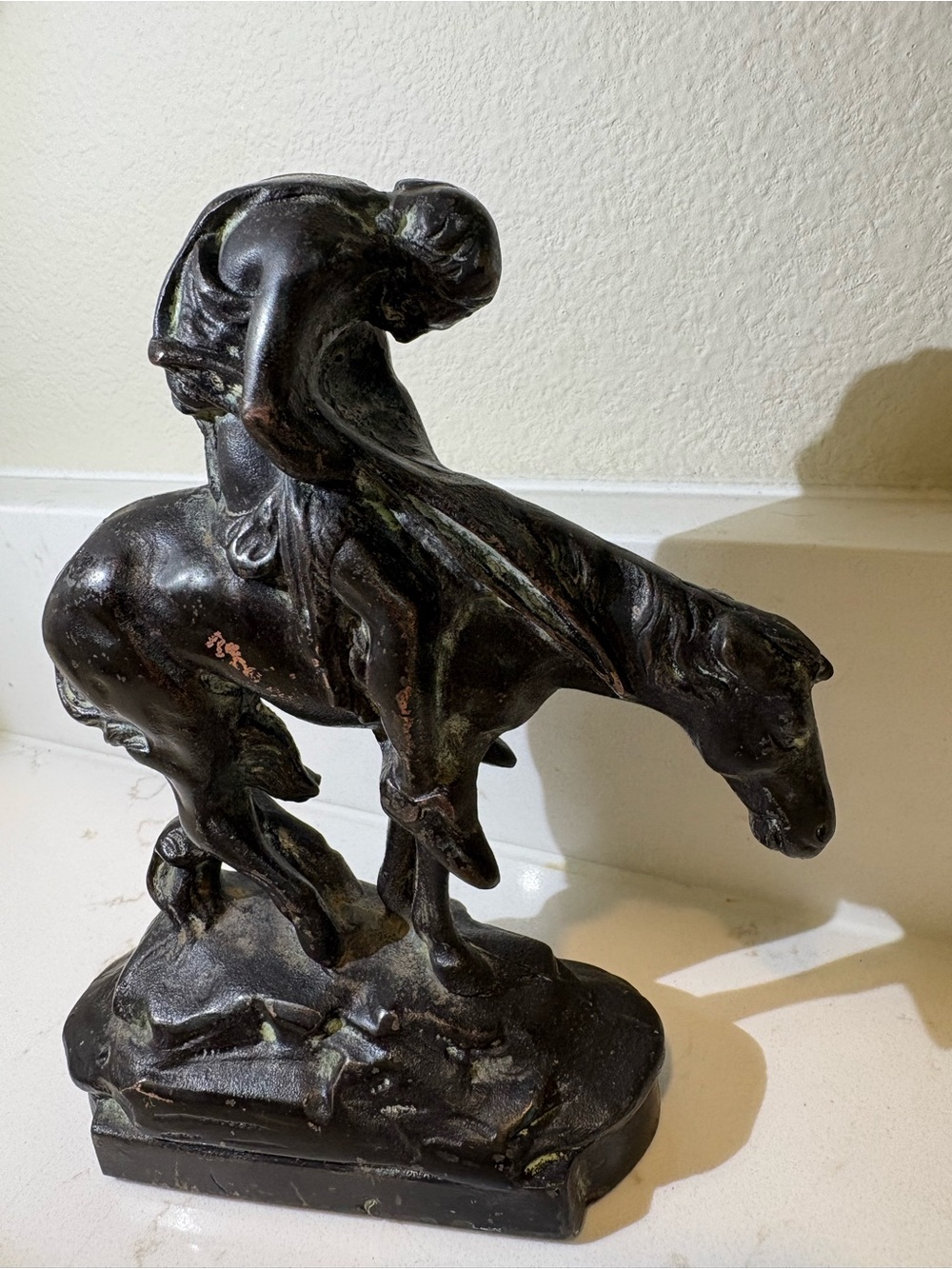Copper plated cast iron “End of trail” Native American on horse sculpture